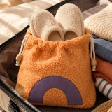Arco Slipper Pouch packed in a suitcase