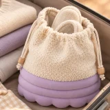 Cumulo Slipper Pouch packed in a suitcase