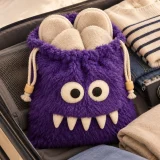 Grumbo Slipper Pouch packed in a suitcase