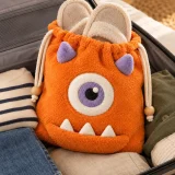 Nomlet Slipper Pouch packed in a suitcase