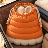 Puffa Slipper Pouch packed in a suitcase